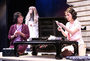 Patricia as Teruko reading an obituary about Himiko Hamilton